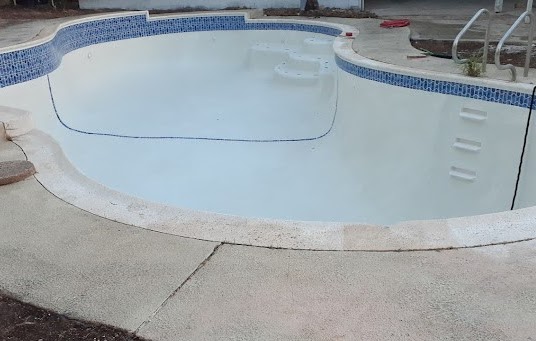 Fresh white plaster filling with blue tile